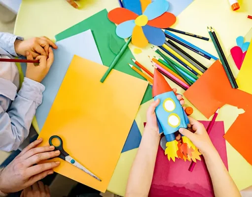 Creative Ways To Ease The Boredom Of A Rainy Day At A Hotel Crayons, cards, scissors, and hands.