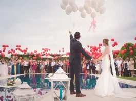 couple releasing balloons at their wedding
