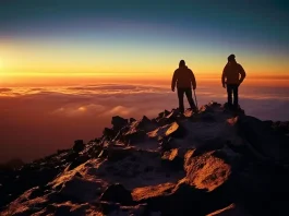 climbers on the top of Mount Kilimanjaro in Tanzania