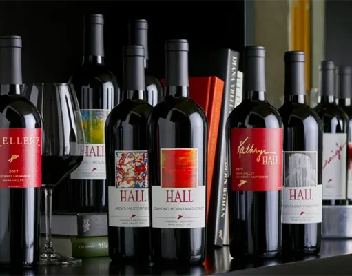 Guana Island Announces Third Wine Program In Partnership With Hall Wines In Napa Valley a collection of wine bottles