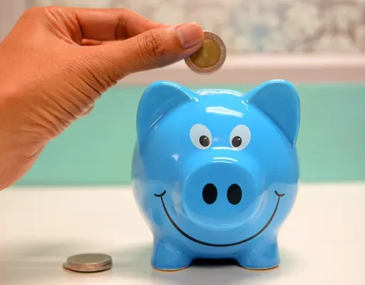 The Ultimate Guide to Saving Money in Europe coin and a piggy bank