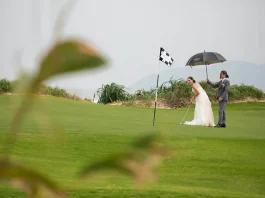 couple playing golf at their wedding