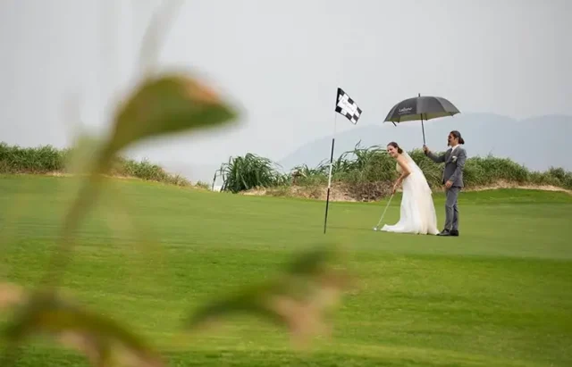 couple playing golf at their wedding