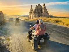 Benefits of Family Quad Biking ATV Quad Bike in front of mountains landscape