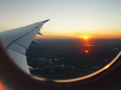 Why Travel-Based Team Building Inspires Collaborative Excellence Sunset seen from a plane