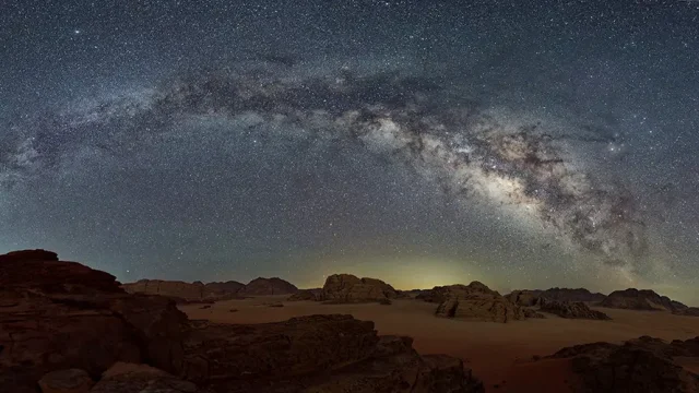 Milky way with the starry night background over the dessert land, Wadi Rum, Jordan