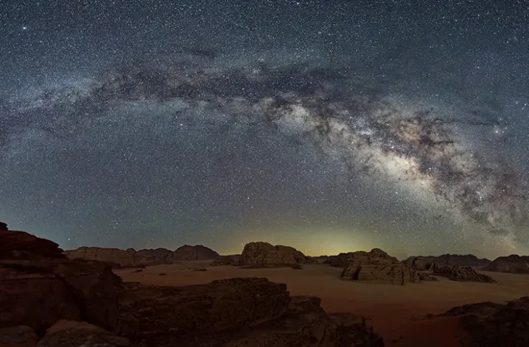 Milky way with the starry night background over the dessert land, Wadi Rum, Jordan
