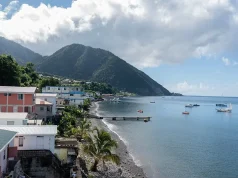The Caribbean Island of Dominica Adventure Packages Rocky beach in Dominica, Roseau. Caribbean coastal city with access to the sea.