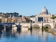 Where to Go 2024 – Top Travel Destinations Rome and Vatican city skyline with Basilica St. Peter's, Tiber river, Ponte Sant' Angelo (Bridge of Holy Angel) in autumn morning