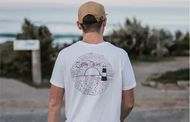 man with a travel t-shirt on
