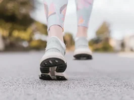 close up of a person walking in comfortable shoes.