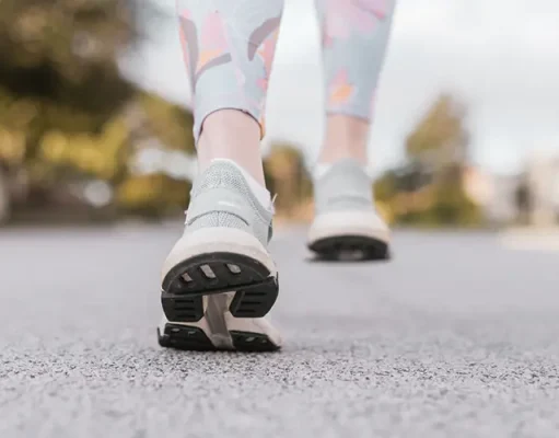 Top 10 Must-Have Travel Gear Ideas for Traveling to Europe close up of a person walking in comfortable shoes.