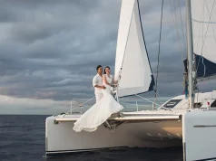 Yacht Weddings and Maritime Laws in San Diego Wedding couple is hugging on a yacht.