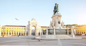 Why Lisbon Belongs on Every Art Lover’s Fall Travel List Morning view on the Commerce square with statue fo king Joseph and Triumphal arch in Lisbon city, Portugal
