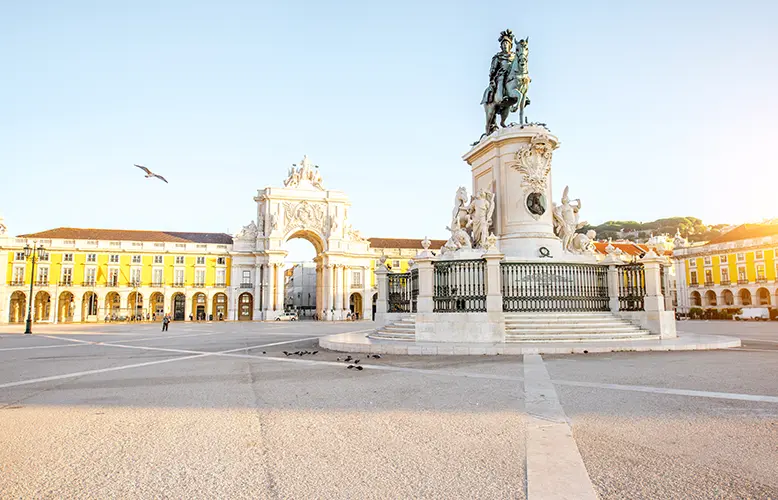 Morning view on the Commerce square with statue fo king Joseph and Triumphal arch in Lisbon city, Portugal