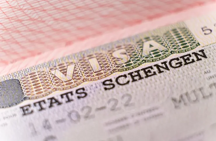 Macro shot biometric passport with schengen visa. European visitor visa for tourism and travel in EU