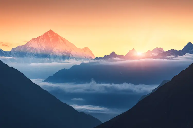 Mountains and low clouds at sunrise in Nepal