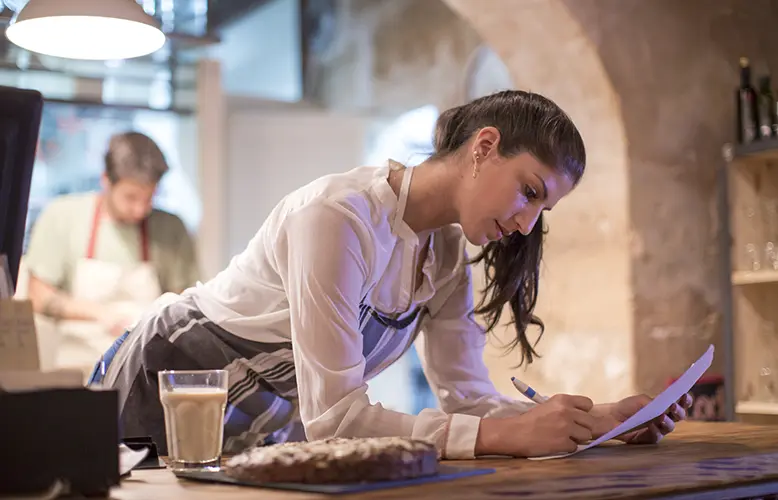 Restaurant owners working in kitchen