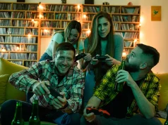 Currency of Fun: How Casino Bonuses Can Fund Your Next Canadian Travel Escapade A group of friends playing video games while relaxing at home