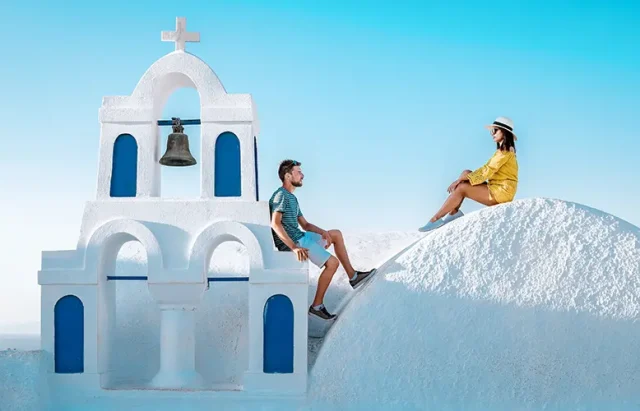 couple honeymoon on vacation Greece visisting Oia Santorini