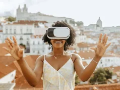 The Game-Changing Technologies Simplifying Travel Happy millennial african american woman in vr glasses in city, enjoy summer travel and online game