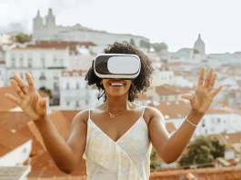 Happy millennial african american woman in vr glasses in city, enjoy summer travel and online game