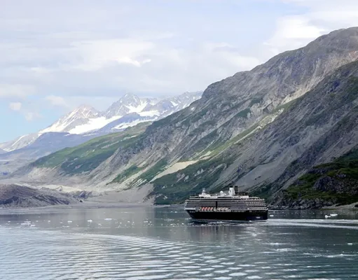 Guide to Unforgettable Fun with Friends on Your Cruise Adventure View of the mountains & a cruise ship in the Inside Passage Alaska United States.
