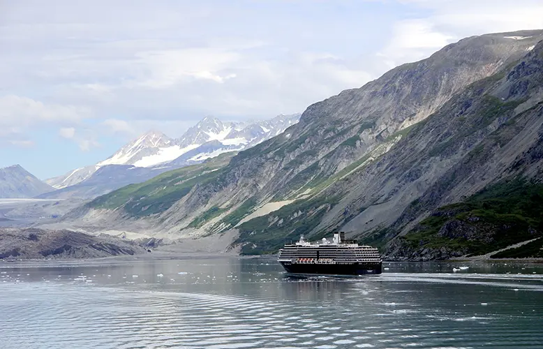 View of the mountains & a cruise ship in the Inside Passage Alaska United States.