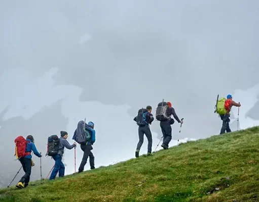 What to Wear for Your Next Hiking Adventure: A Gear Guide for All Season group of travelers climbing the mountain
