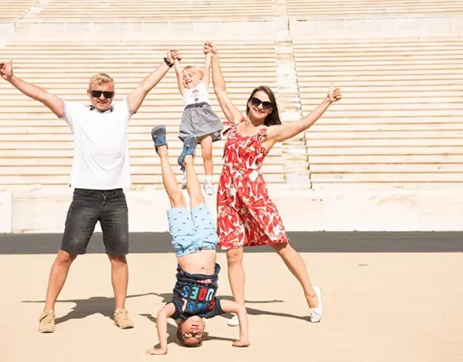Best Places In Southern Europe For A Family Holiday Family having fun on Panathenaic Stadium in Athens, Greece