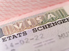 How To Apply For A Switzerland Schengen Visa For Philippine Tourists Macro shot biometric passport with schengen visa.