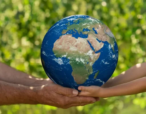 Eco-Friendly Escapes: EarthCheck Certification man and child holding blue planet earth in hands against spring green background