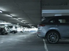 Navigating the Airport: The Pros and Cons of Long-Term vs Short-Term Parking Options Back of a suv car parked in lot of garage.
