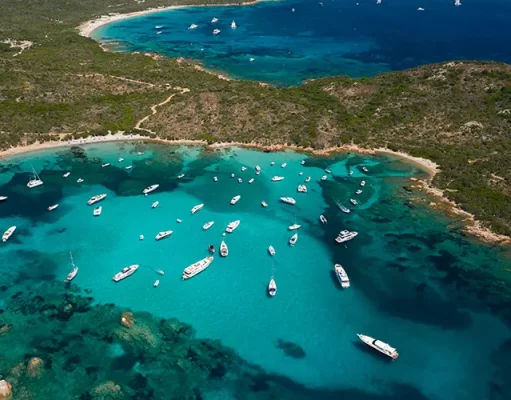 Yacht Life Begins At 40 With New Yacht Week Adventure a group of boats ready for Yacht Week in Sardinia over 40