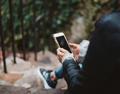 What Is Esimatic? A person using smartphone