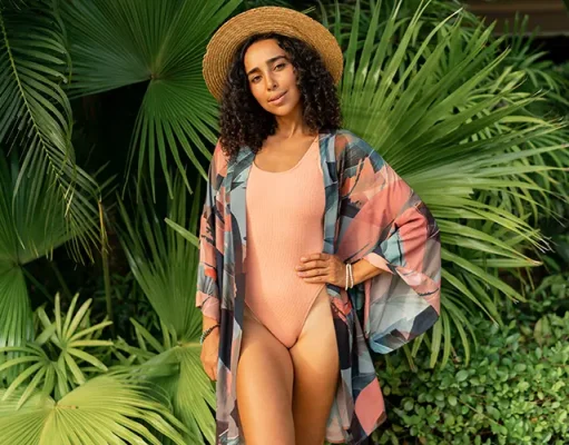 Expert Ideas for the Perfect Swimwear and Cover-Up Combo woman in straw hat and summer stylish outfit posing in tropical garden