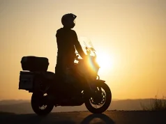 Embarking on a Moto Adventure: Traveling the Country with Your Motorcycle Motorcycle driver riding on countryside