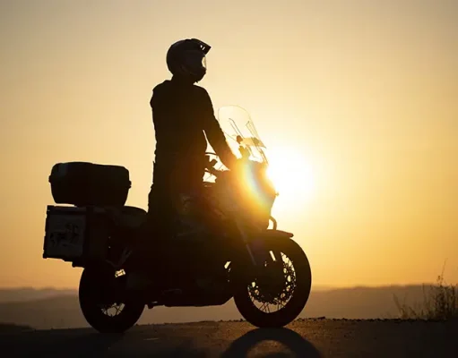 Embarking on a Moto Adventure: Traveling the Country with Your Motorcycle Motorcycle driver riding on countryside