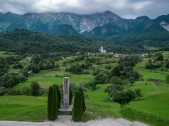 Slovenia’s Green Heart: A Journey Through Sustainable Tourism and Natural Wonders Drežnica village, Slovenia. Drone aerial view. Picturesque rural green landscape