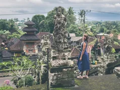 7 Affordable Culinary Travel Destinations for Budget Travelers woman standing at the stairs inside landmark in Bali