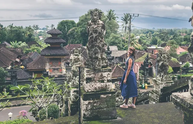 woman standing at the stairs inside landmark in Bali