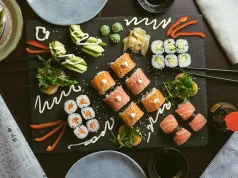 How to Enjoy Local Cuisine While Sticking to Your Diet sushi on black ceramic plate
