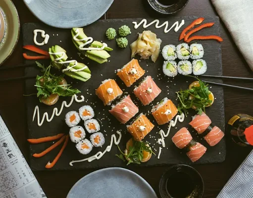 How to Enjoy Local Cuisine While Sticking to Your Diet sushi on black ceramic plate