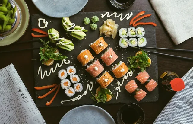 sushi on black ceramic plate