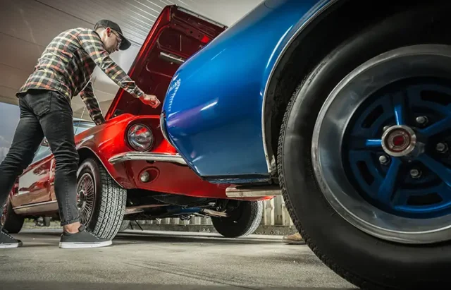 American Classic Cars Enthusiast in His 30s Working on His Vehicle