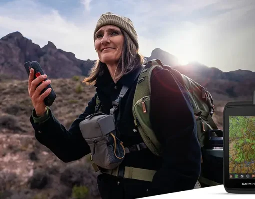 Garmin announces new Montana handheld GPS person hiking with a Garmin Montana 710i GPS in her hand