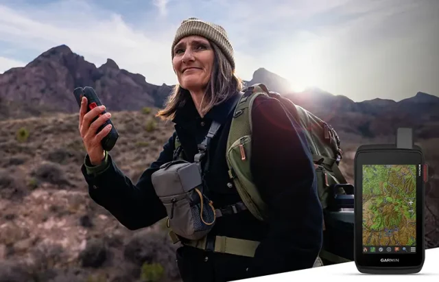 person hiking with a Garmin Montana 710i GPS in her hand