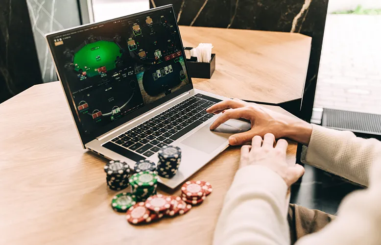 young-man-play-online-poker-in-laptop-2025-01-08-10-08-48-utc copy