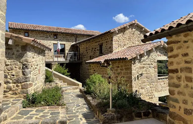 stone buildings and walkways in the French hamlet that is for sale