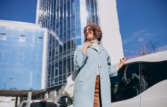 young-business-woman-travelling-by-electro-car copy